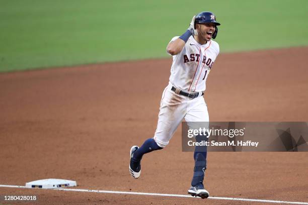 Carlos Correa of the Houston Astros celebrates while rounding the bases after hitting a walk off home run to win 4-3 against Tampa Bay Rays in Game...