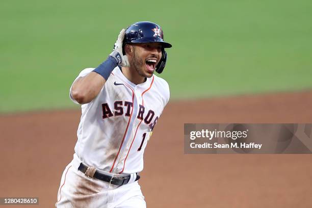 Carlos Correa of the Houston Astros celebrates while rounding the bases after hitting a walk off home run to win 4-3 against Tampa Bay Rays in Game...