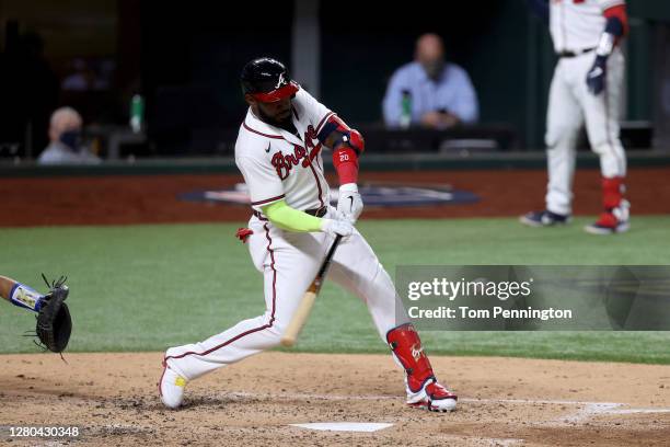 Marcell Ozuna of the Atlanta Braves hits a solo home run against the Los Angeles Dodgers during the fourth inning in Game Four of the National League...