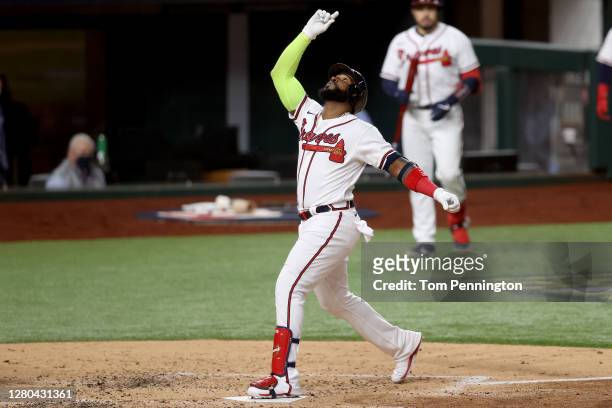 Marcell Ozuna of the Atlanta Braves celebrates after hitting a solo home run against the Los Angeles Dodgers during the fourth inning in Game Four of...