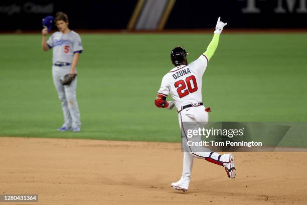 Marcell Ozuna of the Atlanta Braves celebrates af a solo home run against the Los Angeles Dodgers during the fourth inning in Game Four of the...