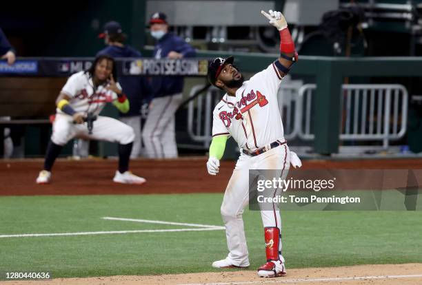 Marcell Ozuna of the Atlanta Braves celebrates after hitting a solo home run against the Los Angeles Dodgers during the seventh inning in Game Four...