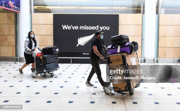 Passengers wearing facemasks as they arrive into the international arrivals area at Sydney's Kingsford Smith Airport after landing on Air New Zealand...