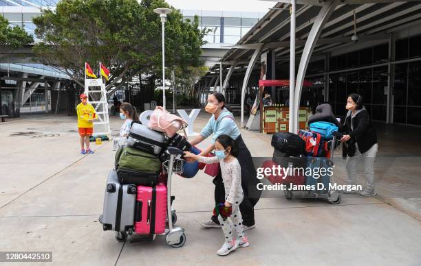 Passengers wearing facemasks as they arrive into the international arrivals area at Sydney's Kingsford Smith Airport after landing on Air New Zealand...