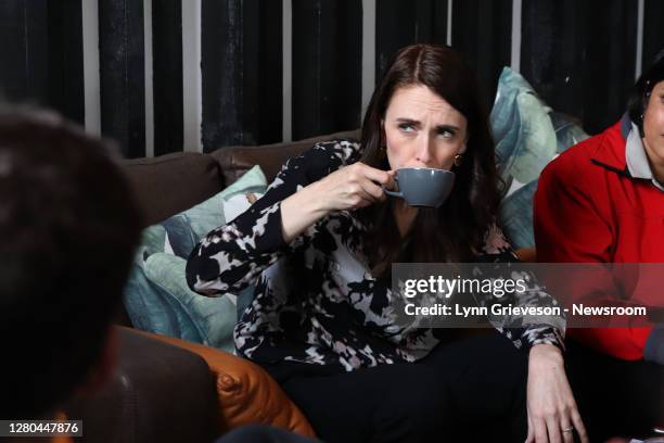 New Zealand Prime Minister Jacinda Ardern drinks a cup of tea in an Onehunga Cafe to meet the team from Everybody Eats on October 16, 2020 in...