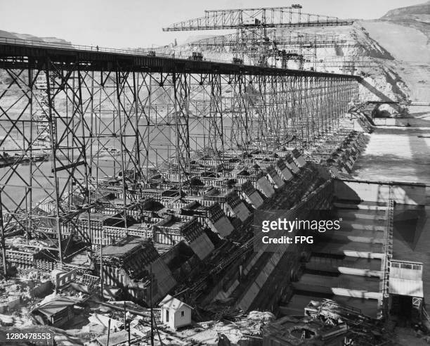 The steel frame of the Grand Coulee Dam, a concrete-built hydroelectric power station, during construction on the Columbia River in the State of...
