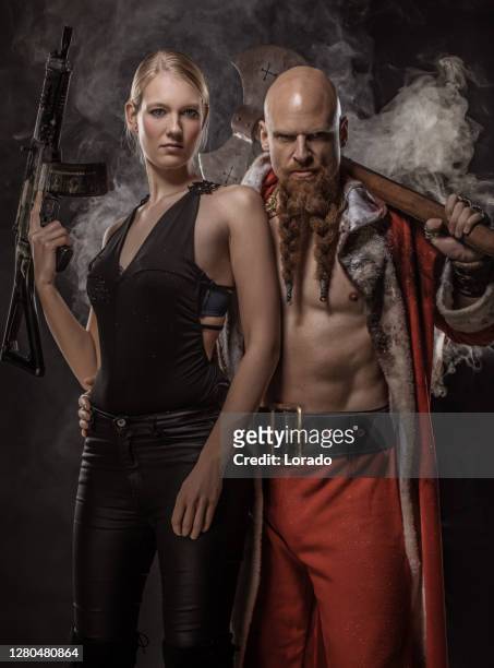 bad santa claus with female gangster - female gangster stock pictures, royalty-free photos & images