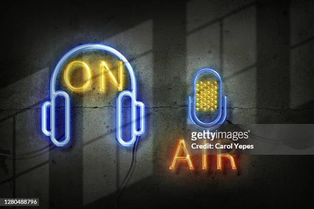 microphone in the old studio with on air sign in neon lights - microphone desk stock pictures, royalty-free photos & images