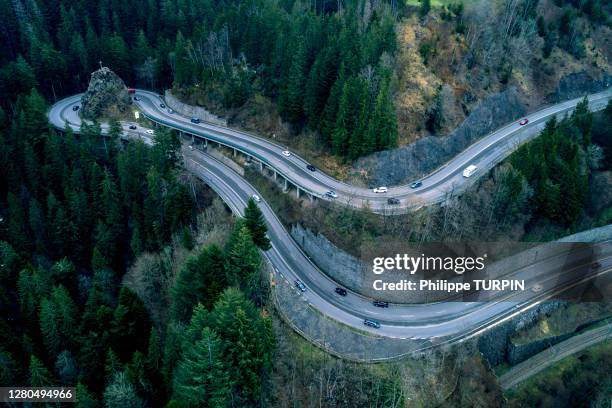 europe, germany, bade-wurtemberg, breitnau, winding road through the black forest - black forest germany stock pictures, royalty-free photos & images