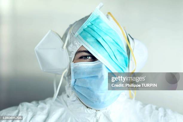 protection against coronavirus. man with different type of masks. - funny surgical masks stock pictures, royalty-free photos & images