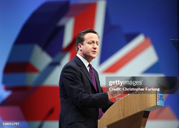 British Prime Minister David Cameron delivers his keynote speech to delegates at the annual Conservative Party Conference at Manchester Central on...