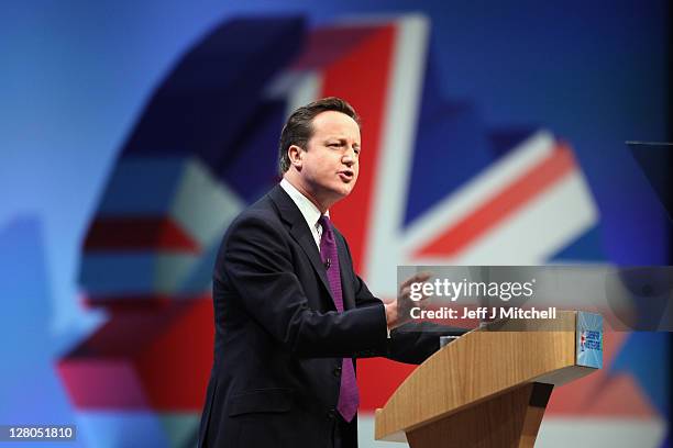 British Prime Minister David Cameron delivers his keynote speech to delegates at the annual Conservative Party Conference at Manchester Central on...