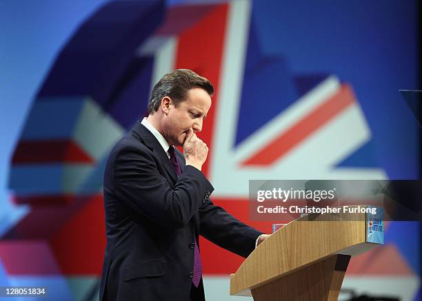 British Prime Minister David Cameron delivers his keynote speech to delegates at the annual Conservative Party Conference at Manchester Central on...