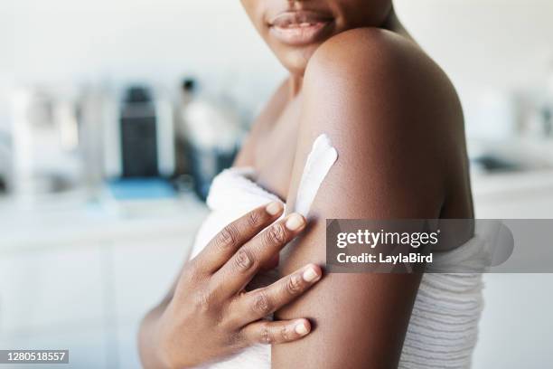 keep your skin hydrated - woman arm around stock pictures, royalty-free photos & images