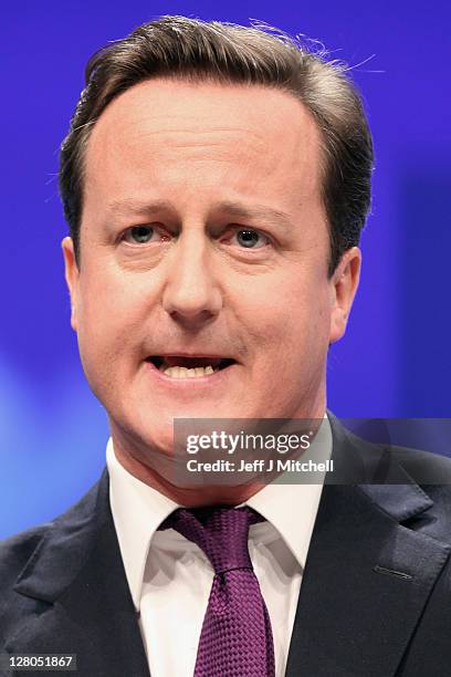 British Prime Minister David Cameron delivers his keynote speech to delegates at the annual Conservative Party Conference at Manchester Central on...