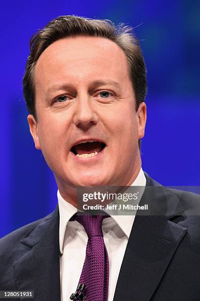 British Prime Minister David Cameron delivers his keynote speech to delegates at the annual Conservative Party Conference at Manchester Central on...