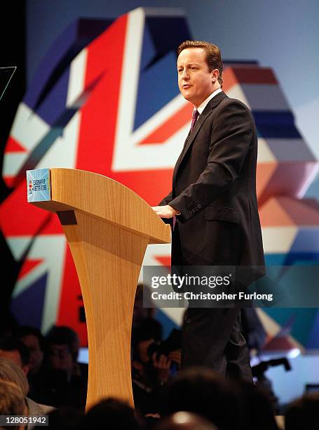 British Prime Minister David Cameron delivers his keynote speech to delegates at the annual Conservative Party Conference at Manchester Central on...