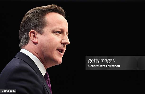 British Prime Minister David Cameron delivers his keynote speech to delegates at the annual Conservative Party Conference at Manchester Central on...