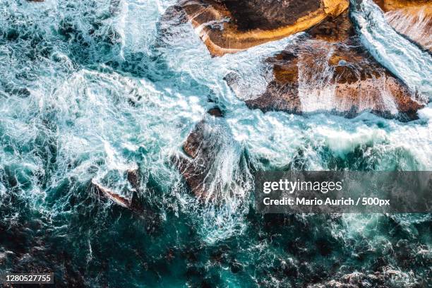 aerial view of sea waves, camps bay beach, south africa - dramatische landschaft stock pictures, royalty-free photos & images