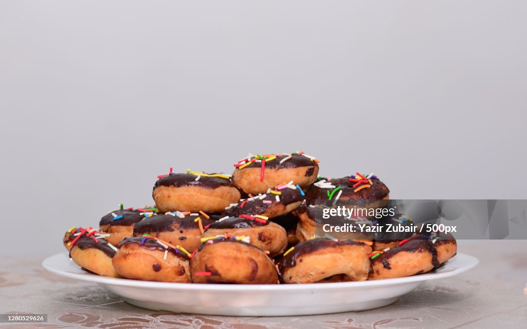 Close-up of donuts in plate on table,Kandy,Sri Lanka