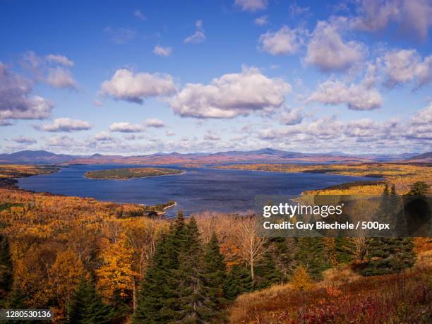 scenic view of landscape against sky during autumn, mooselookmeguntic lake, united states - mooselookmeguntic lake stock pictures, royalty-free photos & images