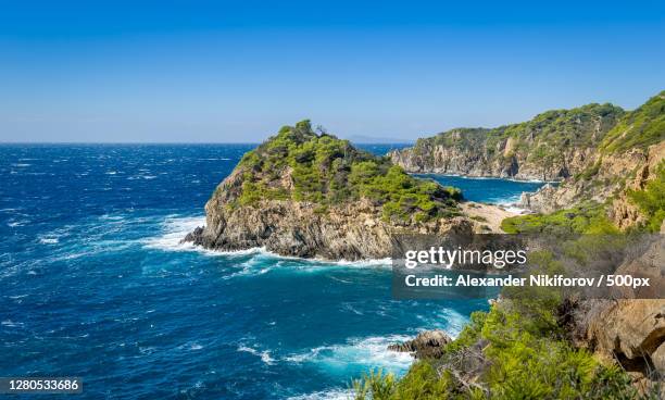 scenic view of sea against clear blue sky - porquerolles stock pictures, royalty-free photos & images