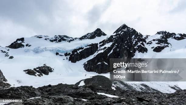 scenic view of snowcapped mountains against sky,tierra del fuego,argentina - alpinismo stock pictures, royalty-free photos & images