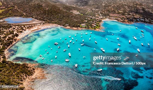aerial view of boats moored at beach,porto cervo,sardegna,italy - sardenha imagens e fotografias de stock