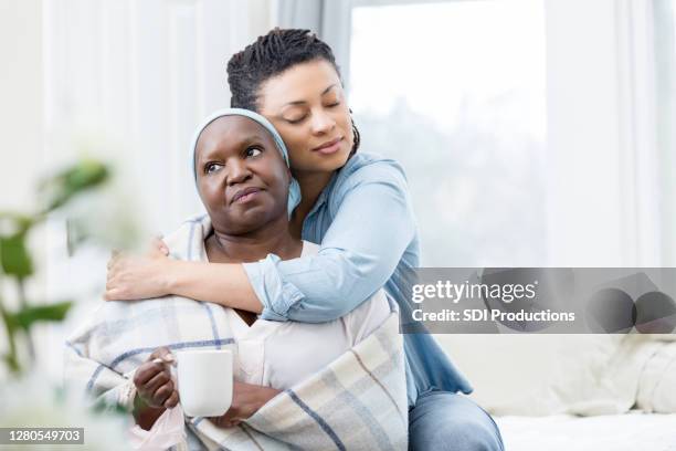 daughter cares for senior mother - cancer patient with family stock pictures, royalty-free photos & images