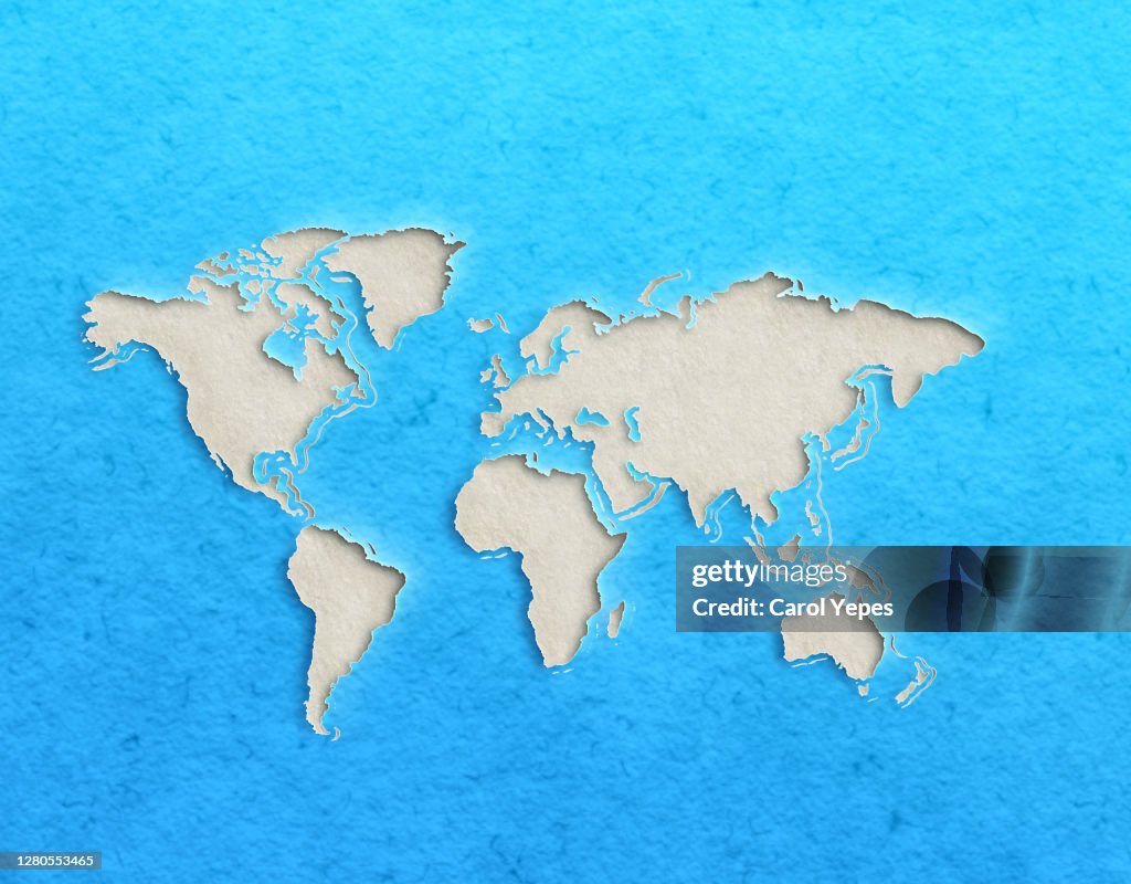 World map with paper cut effect on blue background