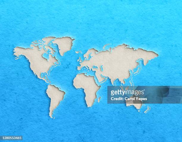 world map with paper cut effect on blue background - europa continente foto e immagini stock
