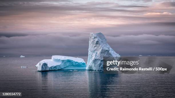 scenic view of icebergs in sea against sky during sunset,antarctica - antarctica whale stock pictures, royalty-free photos & images