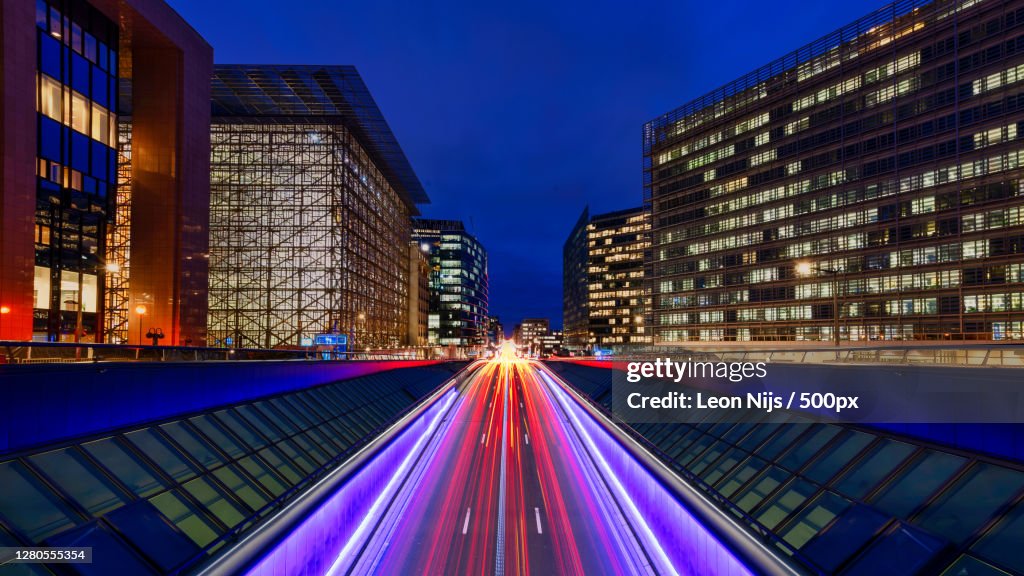 High angle view of illuminated street light trails on city street at night,Wetstraat,Brussel,Belgium