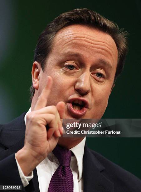 British Prime Minister David Cameron delivers his keynote speech to delegates at the annual Conservative Party Conference at Manchester Central on...