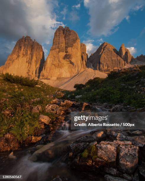 scenic view of rocky mountains against sky - rossetto stock pictures, royalty-free photos & images