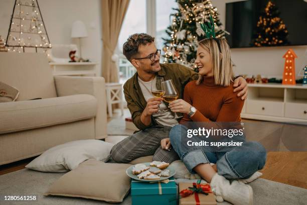 enjoying wine during new year - wine christmas stock pictures, royalty-free photos & images