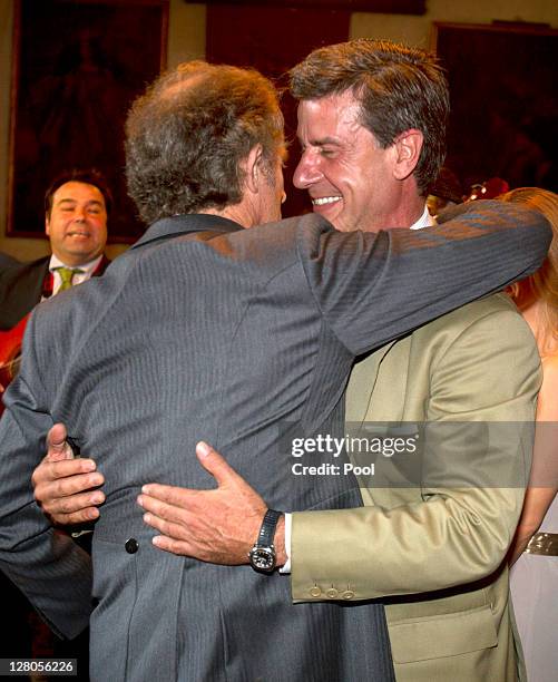 Alfonso Diez Carabantes hugs Cayetano Martinez de Irujo, son of the Duchess of Alba during his wedding ceremony to Duchess of Alba, Maria del Rosario...