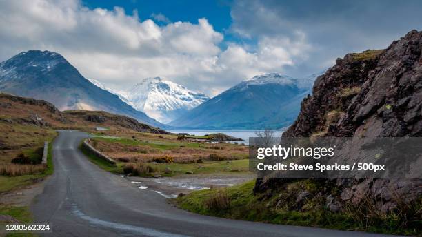 empty road leading towards mountains against sky,wasdale head,england,united kingdom,uk - copeland cumbria stock pictures, royalty-free photos & images