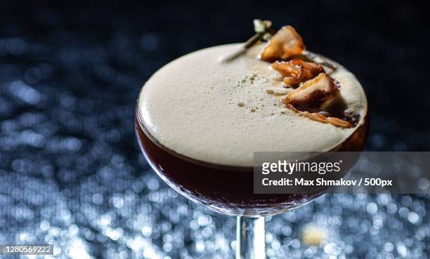 close-up of drink on table - espresso martini stock-fotos und bilder