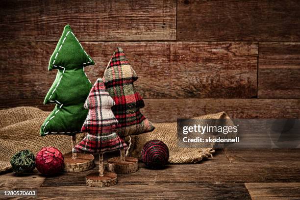 christmas tree decorations on a retro wood background - christmas tartan stock pictures, royalty-free photos & images