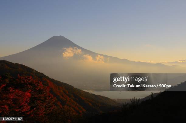 scenic view of mountains against sky during sunset - karato stock pictures, royalty-free photos & images