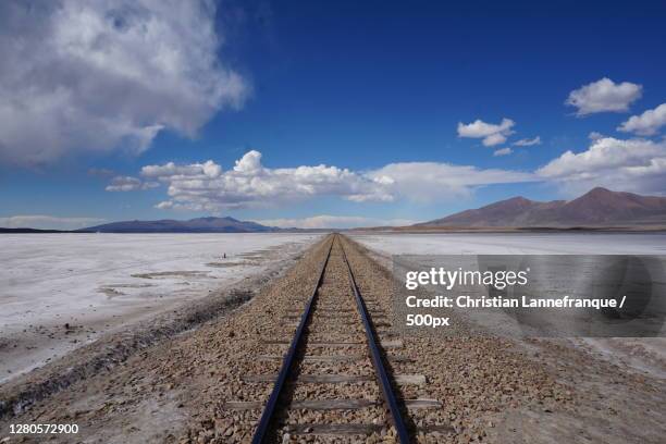 view of railroad tracks against sky,uyuni,bolivia - potosi bolivia stock pictures, royalty-free photos & images