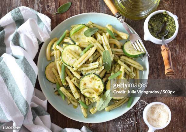 directly above shot of pasta in plate on table - calabacín fotografías e imágenes de stock