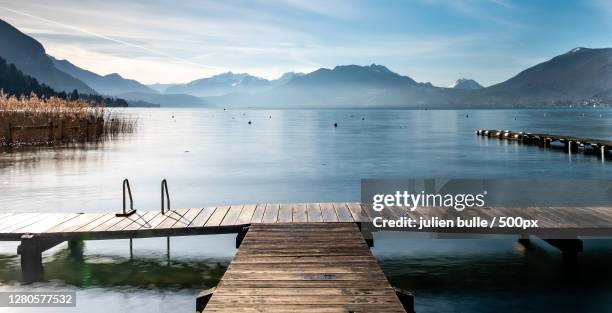 scenic view of lake against sky,annecy,france - ponton photos et images de collection