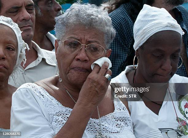 Raquel Villa, sister of Cuban musician Ignacio Villas, known as Bola de Nieve, wipes tears as she takes part in a pilgrimage to commemorate his 40...