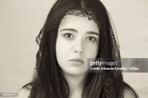 portrait of young woman against white background,plasencia,extremadura,spain - luto stock pictures, royalty-free photos & images