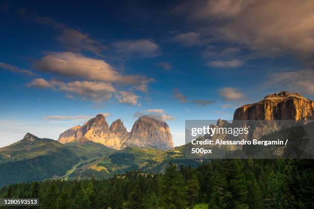 scenic view of mountains against sky, canazei, province of trento, italy - sig bergamin foto e immagini stock