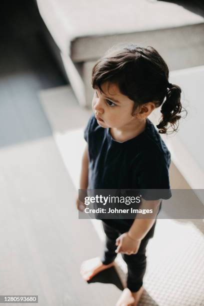 high angle view of girl looking away - girl who stands stock pictures, royalty-free photos & images