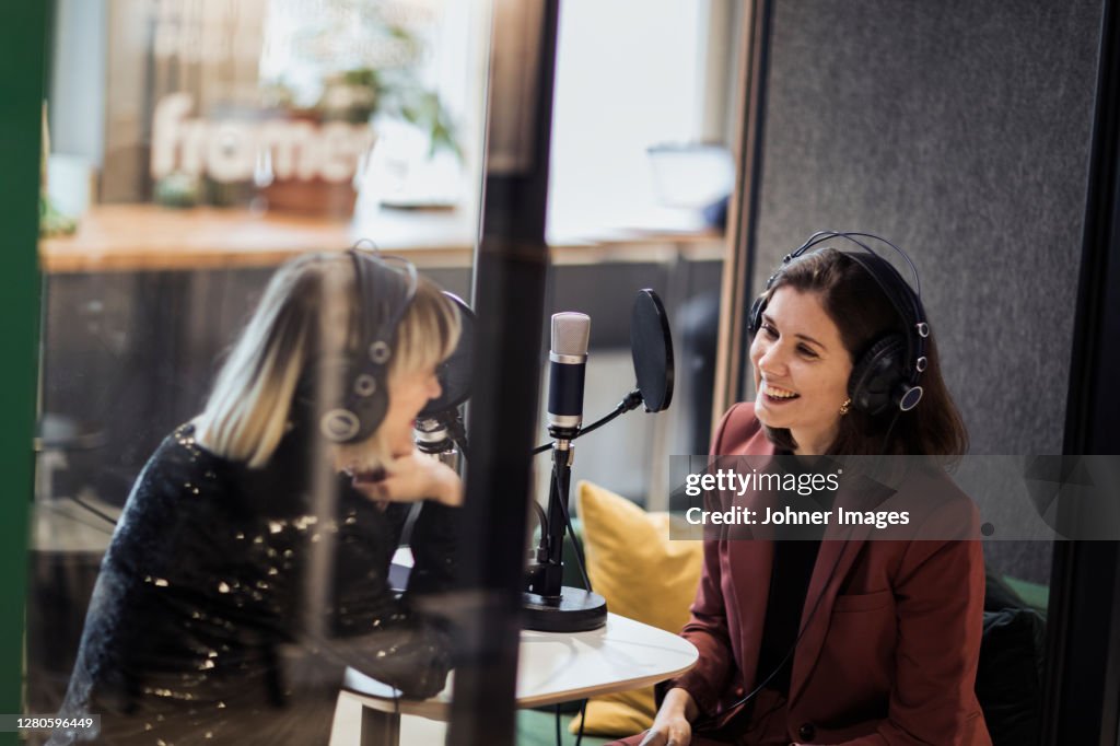 Woman broadcasting from radio station