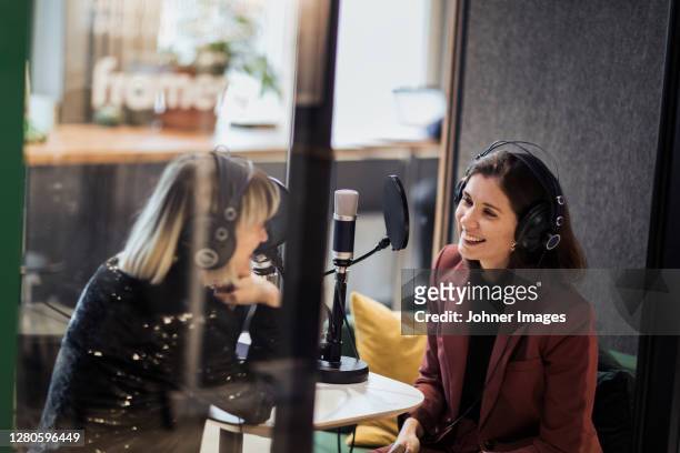 woman broadcasting from radio station - journalist stock pictures, royalty-free photos & images